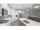 Bright kitchen boasts a spacious island with sink and seating, perfect for entertaining at 3504 Big Sky Way, Bradenton, FL 34211