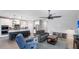 Bright and spacious living room connected to the modern kitchen and dining area at 3504 Big Sky Way, Bradenton, FL 34211