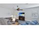 Inviting living room featuring cozy seating, a ceiling fan, and a TV at 3504 Big Sky Way, Bradenton, FL 34211