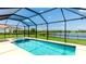 Enjoy the lake view from the screened-in pool and spa at 3504 Big Sky Way, Bradenton, FL 34211