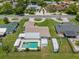 Aerial view of property showcasing the pool, well-maintained lawn, and RV parking at 3621 S Lockwood Ridge Rd, Sarasota, FL 34239