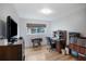 Bedroom with desk, wooden floors, and a view of the outside at 3621 S Lockwood Ridge Rd, Sarasota, FL 34239