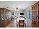 Bright dining room featuring luxury vinyl floors, a ceiling fan, and wooden furniture at 3621 S Lockwood Ridge Rd, Sarasota, FL 34239