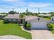 Charming single-story home with a well-maintained lawn, inviting curb appeal, and two car garage at 3621 S Lockwood Ridge Rd, Sarasota, FL 34239