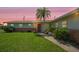 Charming single story home boasts a manicured lawn, mature landscaping and lovely curb appeal at 3621 S Lockwood Ridge Rd, Sarasota, FL 34239