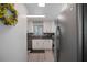 Kitchen showcasing modern stainless steel appliances, granite countertops, and white cabinets at 3621 S Lockwood Ridge Rd, Sarasota, FL 34239