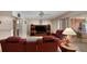 Comfortable living room with neutral walls, wood floors, and inviting seating arrangement at 3621 S Lockwood Ridge Rd, Sarasota, FL 34239