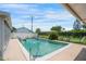Inviting backyard pool, surrounded by a concrete patio, is perfect for relaxation and enjoying the sunny outdoors at 3621 S Lockwood Ridge Rd, Sarasota, FL 34239