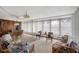 Spacious sunroom with wicker furniture, large windows, and natural light at 3621 S Lockwood Ridge Rd, Sarasota, FL 34239