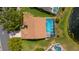 Aerial view of the property featuring a screened-in pool, well-maintained lawn, and lake view at 4120 51St W Dr, Bradenton, FL 34210