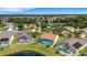Community aerial featuring homes with screened-in pools, lush landscaping, and tranquil lake views at 4120 51St W Dr, Bradenton, FL 34210