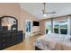 Main bedroom with vaulted ceiling, outdoor view, en-suite bathroom and spacious closet at 4120 51St W Dr, Bradenton, FL 34210