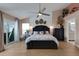 Serene main bedroom with a vaulted ceiling, elegant furnishings, and ample natural light from the sliding door at 4120 51St W Dr, Bradenton, FL 34210