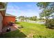 Beautiful backyard featuring well-maintained lawn, brick patio and lovely water view at 4194 Banbury Cir, Parrish, FL 34219