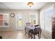 Cozy breakfast nook with plantation shutters, dinette set, and tile flooring at 4194 Banbury Cir, Parrish, FL 34219