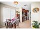 Eat-in kitchen with stainless steel appliances, tile flooring, plantation shutters and cozy breakfast nook at 4194 Banbury Cir, Parrish, FL 34219