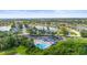 Aerial view of the community pool, spa, and recreational area with ample parking at 4194 Banbury Cir, Parrish, FL 34219