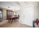 Traditional dining room with wood table and chairs, hutch, chandelier, and tile flooring at 4194 Banbury Cir, Parrish, FL 34219
