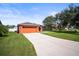 Brightly painted house with 2 car garage and a long driveway in a well-maintained community at 4194 Banbury Cir, Parrish, FL 34219