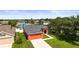 Aerial view showcasing this home's neat landscaping and water view at 4194 Banbury Cir, Parrish, FL 34219