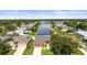 Charming one-story home featuring colorful exterior, well-manicured lawn, and scenic waterfront view at 4194 Banbury Cir, Parrish, FL 34219