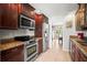 Kitchen features stainless appliances, granite countertops, and stylish wood cabinetry at 4194 Banbury Cir, Parrish, FL 34219
