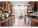 Bright kitchen showcases wood cabinets, stainless appliances, and granite countertops at 4194 Banbury Cir, Parrish, FL 34219