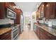 This spacious kitchen boasts stainless appliances, granite counters, and wood cabinetry at 4194 Banbury Cir, Parrish, FL 34219