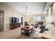 Bright living room features tile floors, large windows, and comfortable seating at 4194 Banbury Cir, Parrish, FL 34219
