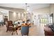 Open-concept living room with tile flooring, fan, and easy access to dining areas at 4194 Banbury Cir, Parrish, FL 34219