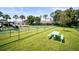 Community playground with picnic tables and fun play structures, surrounded by lush lawns at 4194 Banbury Cir, Parrish, FL 34219
