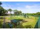 Community playground with swings, slides, climbing structures and picnic tables at 4194 Banbury Cir, Parrish, FL 34219