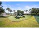 Neighborhood playground featuring slides and lush green turf, perfect for Gathering fun at 4194 Banbury Cir, Parrish, FL 34219