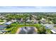 Rear aerial view of the yard and property with a pond view at 4194 Banbury Cir, Parrish, FL 34219