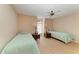 Bright bedroom features two twin beds, wood floors, ceiling fan, and natural light at 4227 Placid Dr, Sarasota, FL 34243