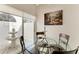 Bright breakfast nook with a glass table, seating for four, and access to outdoor patio at 4227 Placid Dr, Sarasota, FL 34243
