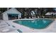 An expansive community pool featuring a lounge area and cabana for outdoor enjoyment and relaxation at 4227 Placid Dr, Sarasota, FL 34243