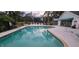 A community pool with a view of the lounging area and cabana for convenience at 4227 Placid Dr, Sarasota, FL 34243