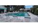 A wonderful community pool featuring a pool-side lounge area and access to a cabana, perfect for relaxing at 4227 Placid Dr, Sarasota, FL 34243