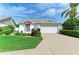 Charming home with well-manicured lawn, mature landscaping, and a two-car garage at 4227 Placid Dr, Sarasota, FL 34243