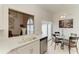 Well-lit kitchen with white countertops, stainless steel appliances, and view to the breakfast nook at 4227 Placid Dr, Sarasota, FL 34243