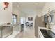 Efficient kitchen with stainless steel appliances, white cabinetry, and an adjacent breakfast nook at 4227 Placid Dr, Sarasota, FL 34243