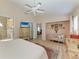 Serene main bedroom featuring a sitting area, ceiling fan, and a neutral color palette at 4227 Placid Dr, Sarasota, FL 34243