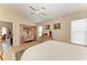 Well-lit main bedroom with seating area, decorative art, and a calming atmosphere at 4227 Placid Dr, Sarasota, FL 34243