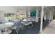 Spacious pool cabana featuring an outdoor lounge area, refreshment bar, ceiling fans, and lots of space at 4227 Placid Dr, Sarasota, FL 34243