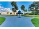 Scenic park view featuring a gazebo, palm trees, and a walking path near the water's edge against a dawn sky at 4227 Placid Dr, Sarasota, FL 34243
