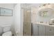 Modern bathroom with glass-enclosed shower, vanity and contemporary fixtures at 4303 83Rd W St, Bradenton, FL 34209