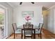 Bright dining area with seating for four, sliding glass door and terra cotta tile flooring at 4303 83Rd W St, Bradenton, FL 34209