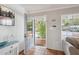 Bright entryway featuring tile flooring, stylish decor, and a welcoming open door at 4303 83Rd W St, Bradenton, FL 34209