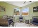 Cozy Florida room featuring wicker furniture, bright light, and tiled flooring at 4303 83Rd W St, Bradenton, FL 34209